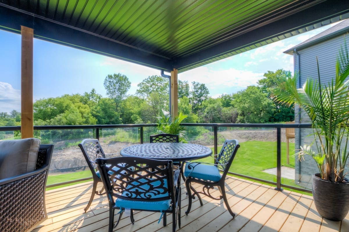 Sunlit patio with views of the greenspace around Meadowlark Ridge.