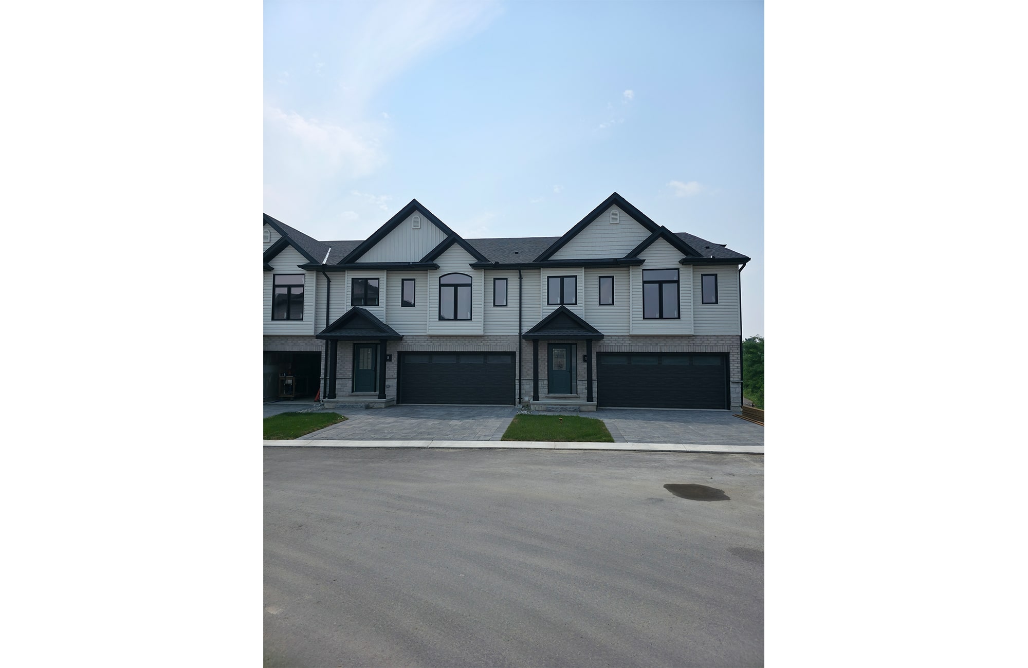 Exterior view The Nest 2 townhomes by Rembrandt Homes.