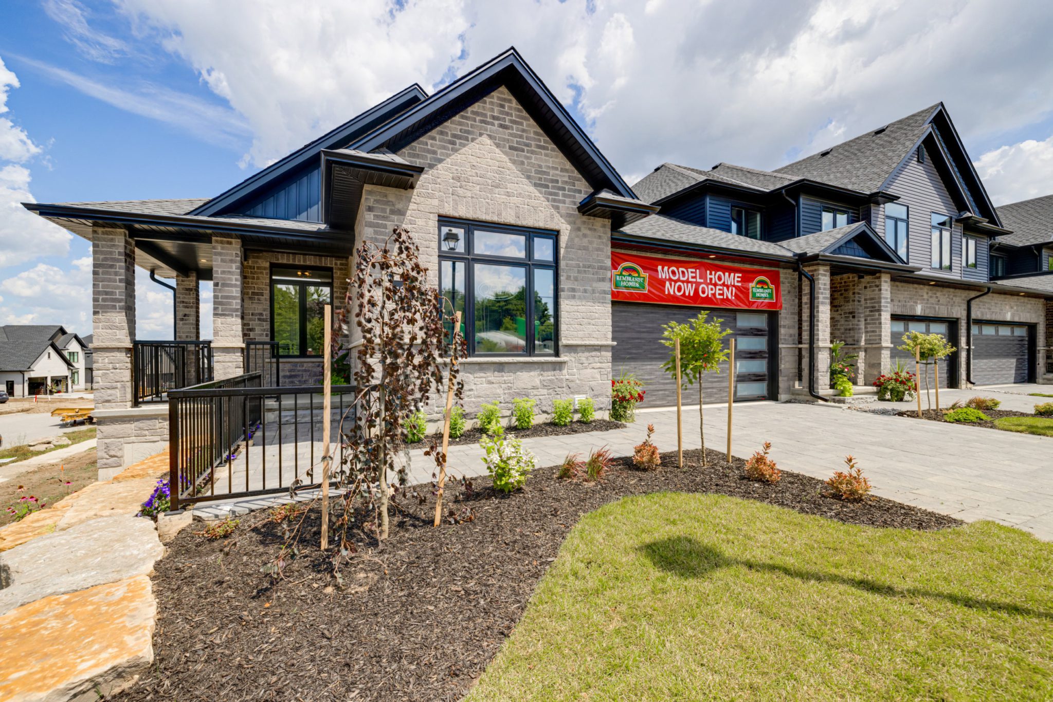 Exterior view of a bungalow-style end unit at Upper West by Rembrandt Homes.