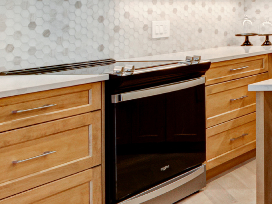 Modern kitchen with warm wood finishes in a Rembrandt home.
