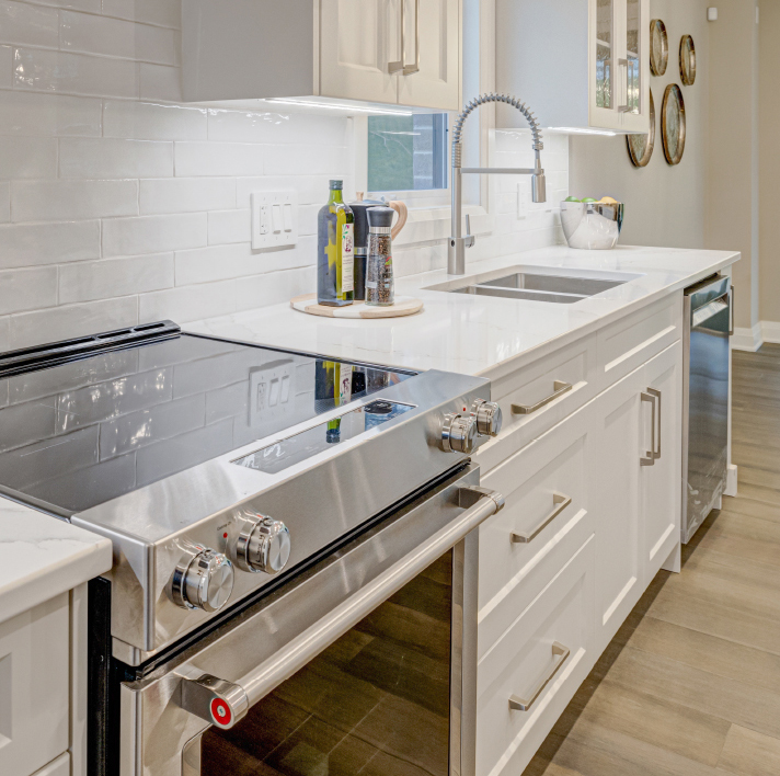 Modern kitchen with sleek white finishes in a Rembrandt home